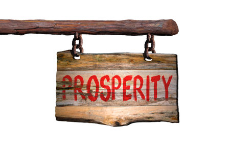 Prosperity motivational phrase sign on old wood with blurred backgroundの写真素材