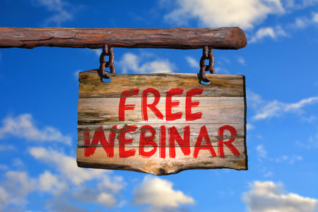 Free webinar motivational phrase sign on old wood with blurred backgroundの写真素材