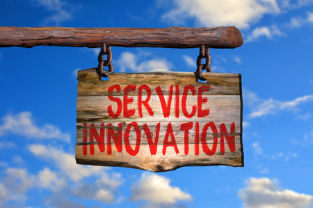 Service innovation motivational phrase sign on old wood with blurred backgroundの写真素材