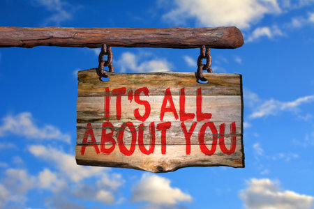 It's all about you motivational phrase sign on old wood with blurred backgroundの写真素材