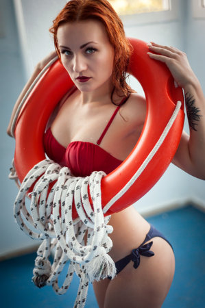 Elegant red swimsuit model woman high-end fashionの写真素材