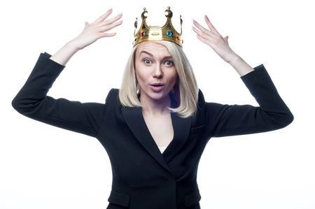 Blond girl with crown on head on white backgroundの写真素材