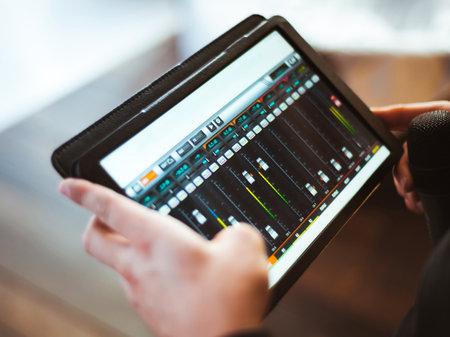 Mixing music on tablet with electronic music instruments conceptの写真素材