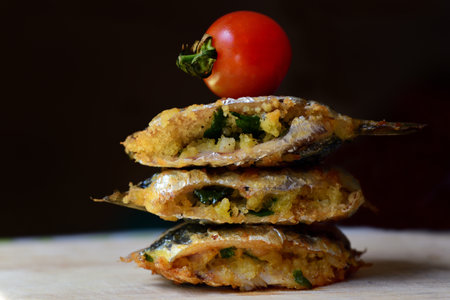 Traditionally Sicilian-style sardines that are stuffed and fried, called becca fico