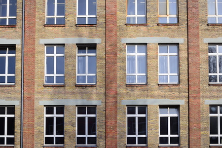 Facade of an old brick factory building with a window front in Augsburg / Germanyの写真素材