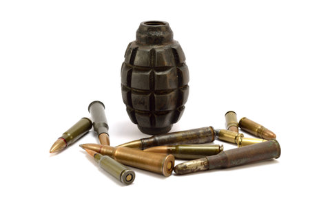 Black bombs and bullets on a white backgroundの写真素材