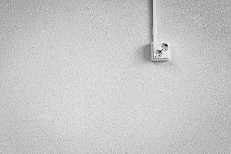 Socket on a white wallの写真素材
