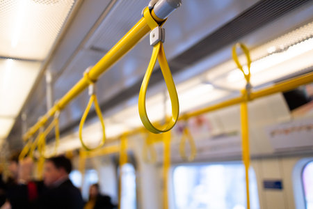 Yellow Hanging Strap in a public transport of Londonの写真素材