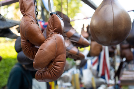 Old boxing gloves and antique objects on a stand of a flea marketの写真素材