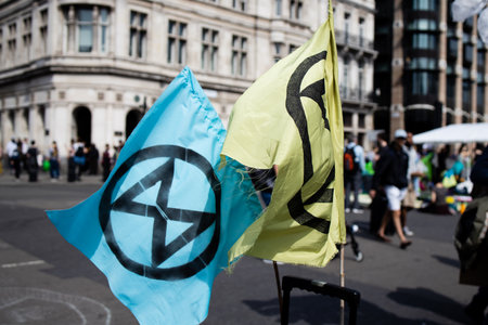 Extinction Rebellion flag during a protest in Londonのeditorial素材