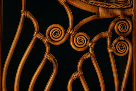 Texture weaving patterns vine on a black background. Wicker Straw.