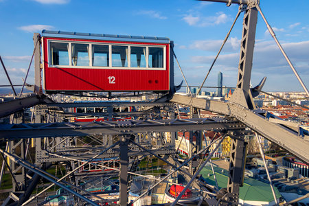 Vienna, park PRATER Austria, 03.29.2019. Wien or Vein. Sunset panorama of Vienna from famous Prater Riesenrad, old giant ferris wheel and famous landmark of the city. carriage 12のeditorial素材