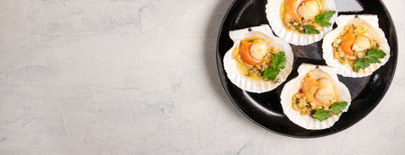 Banner with baked scallops with caviar and creamy garlic sauce. Top view. Copy space. Flat lay