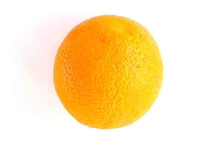 close-up of a ripe, juicy round orange on a white background. fruit isolated soft focusの写真素材
