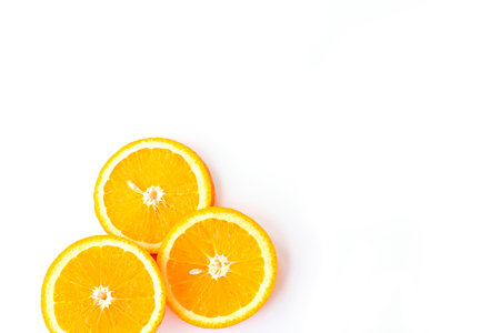 flat lay of ripe, juicy round orange slices on white background. fruit isolated soft focusの写真素材