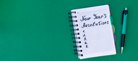 banner with New Year's resolutions concept. New Year's resolutions on a green background. Flat lay. Top viewの写真素材
