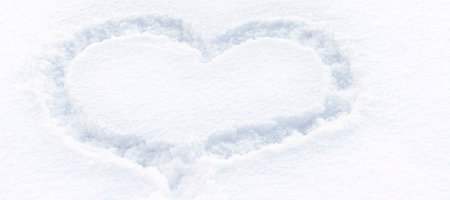 banner with Heart drawn on the snow. winter landscape. soft focusの写真素材