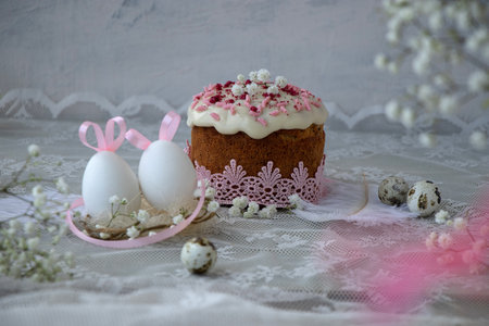 Easter background or postcard. white easter eggs with pink bunny ears in a nest with a pink...