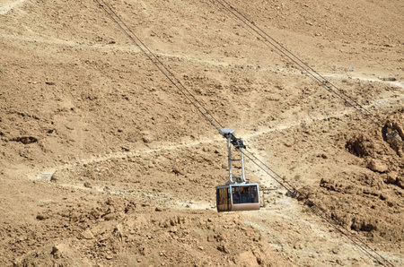 Funicular on Masada fortress and hiking trail in Judea desert, Israel.の写真素材