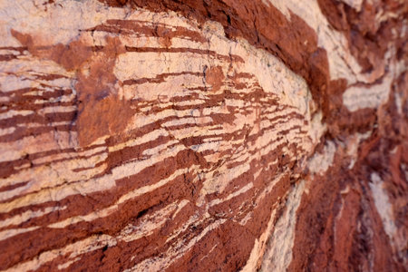 Red sandstone natural background with white stripesの写真素材