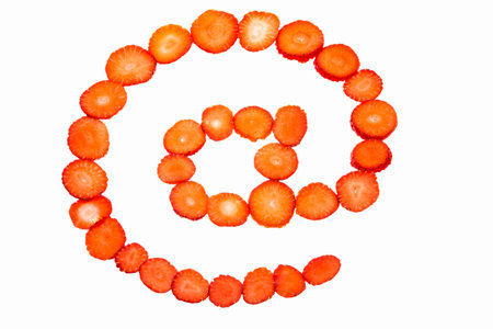 At symbol made from strawberry slices  の写真素材