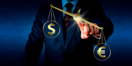 Euro currency sign is outweighing the dollar symbol on a golden pair of balances. Hand of a trader is positioning the weighing scale in mid-air by touch. Rasterized illustration combined with photo.の写真素材