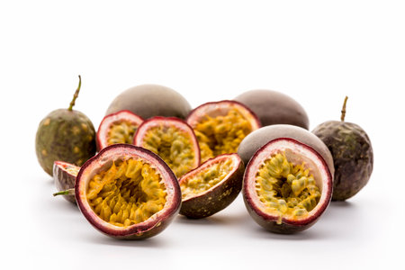 Juicy inner fruit flesh and seeds of several halved passionfruits presented in their hard outer...