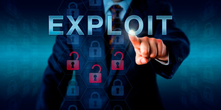 Network administrator touching EXPLOIT on an interactive screen. Network administrator touching EXPLOIT on an interactive screen.