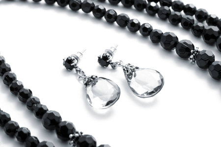 Set black necklace with earring on white backgroundの写真素材