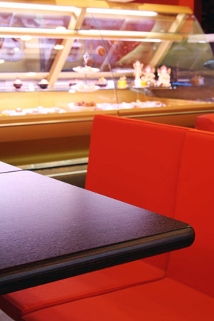Interior cafe in red color with wood table