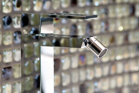 Metallic tap in bath-room detail and close-up