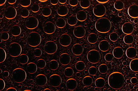 Water bubble black orange background surface macro viewの写真素材