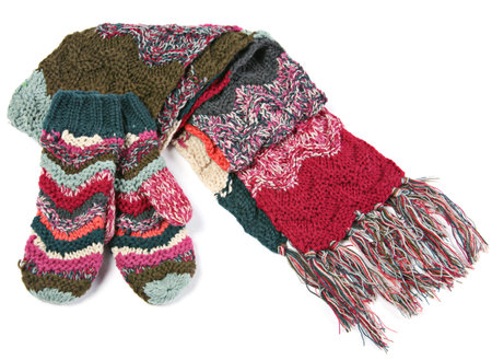 Wool scarf and mitts on white backgroundの写真素材