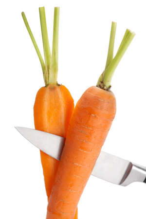 Fresh young carrot vegetable cutting knife on whiteの写真素材