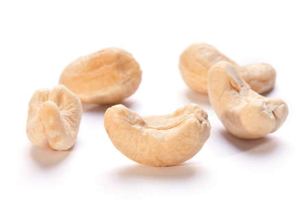 Heap cashew nut closeup with shadow on whiteの写真素材