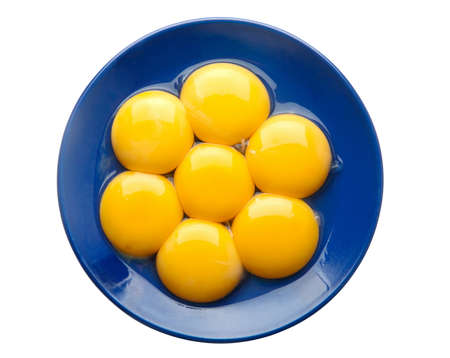 Chicken egg yolk in blue plate