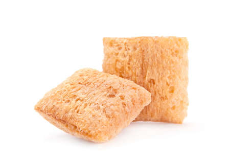 Cornflakes cube snack isolated on whiteの写真素材