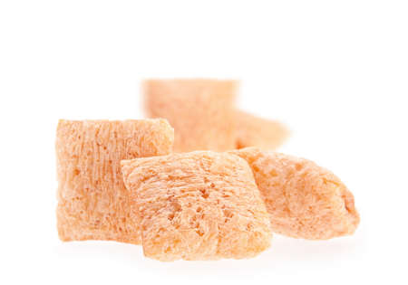 Cornflakes cube snack isolated on white