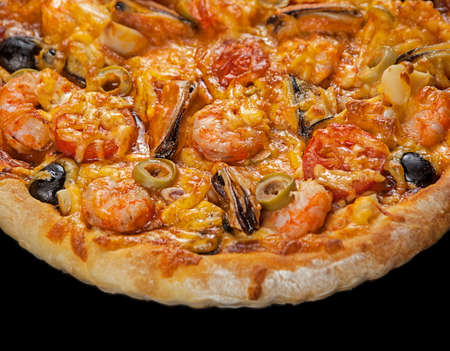 Pizza with seafood srimp on blackの写真素材