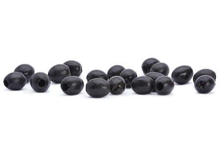 Marinated black pitted olive closeup isolated on white backgroundの写真素材