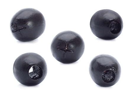 Marinated black olive closeup isolated on white backgroundの写真素材