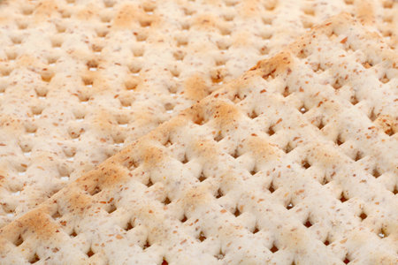 Matzo traditional jewish bread closeup background