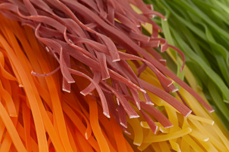 Wheat multicolored noodles closeup backgroundの写真素材