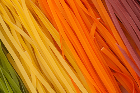 Wheat multicolored noodles closeup backgroundの写真素材
