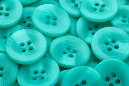 Green plastic button closeup horizontal backgroundの写真素材