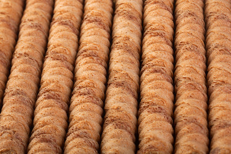 Waffle chocolate rolls stick closeup background