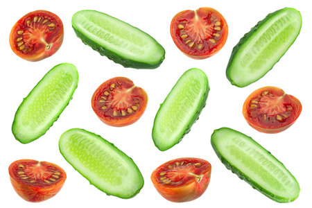 Cucumber and brown cherry tomatoes set on whiteの写真素材