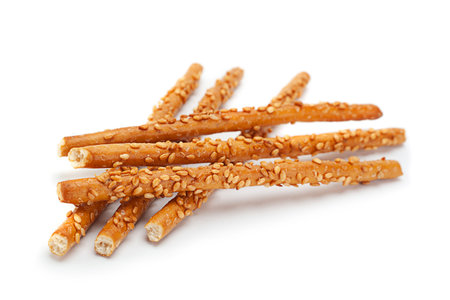 Salted sticks with sesame isolated on white background