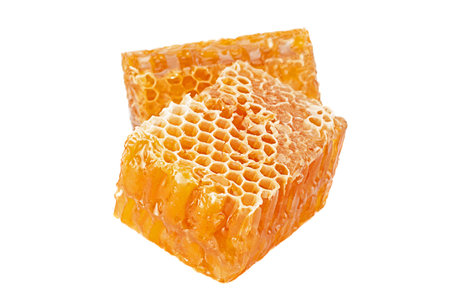Yellow Honeycomb slice closeup isolated on white backgroundの写真素材