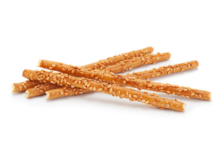 Salted sticks with sesame isolated on white background